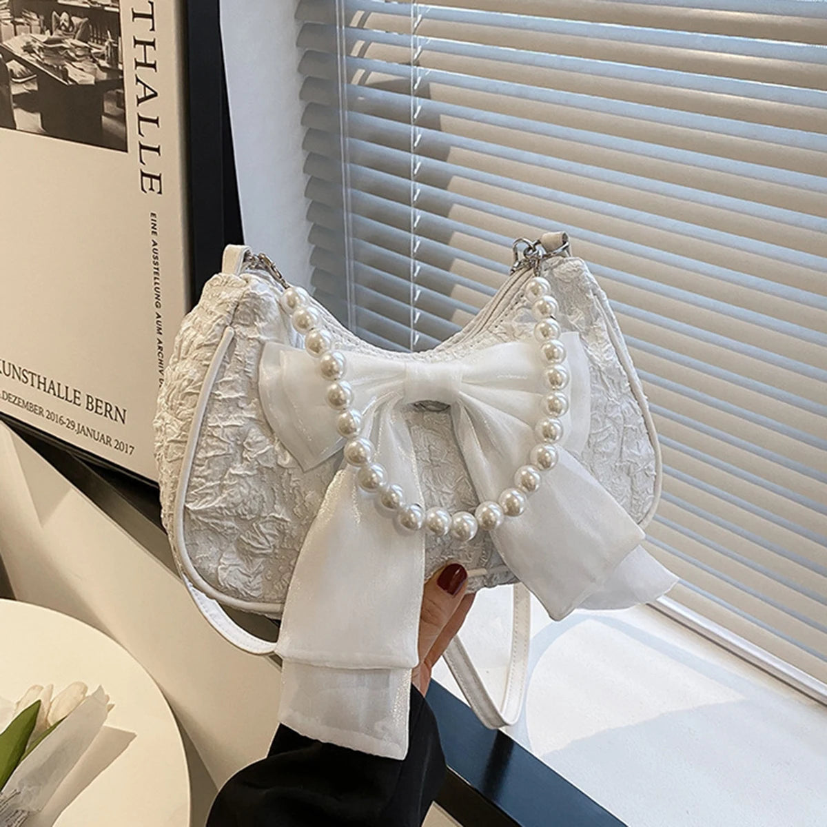 White folds pop retro bow bag Female Pearl handle New fashion pearl armpit shoulder crossbody bag 1 outfit