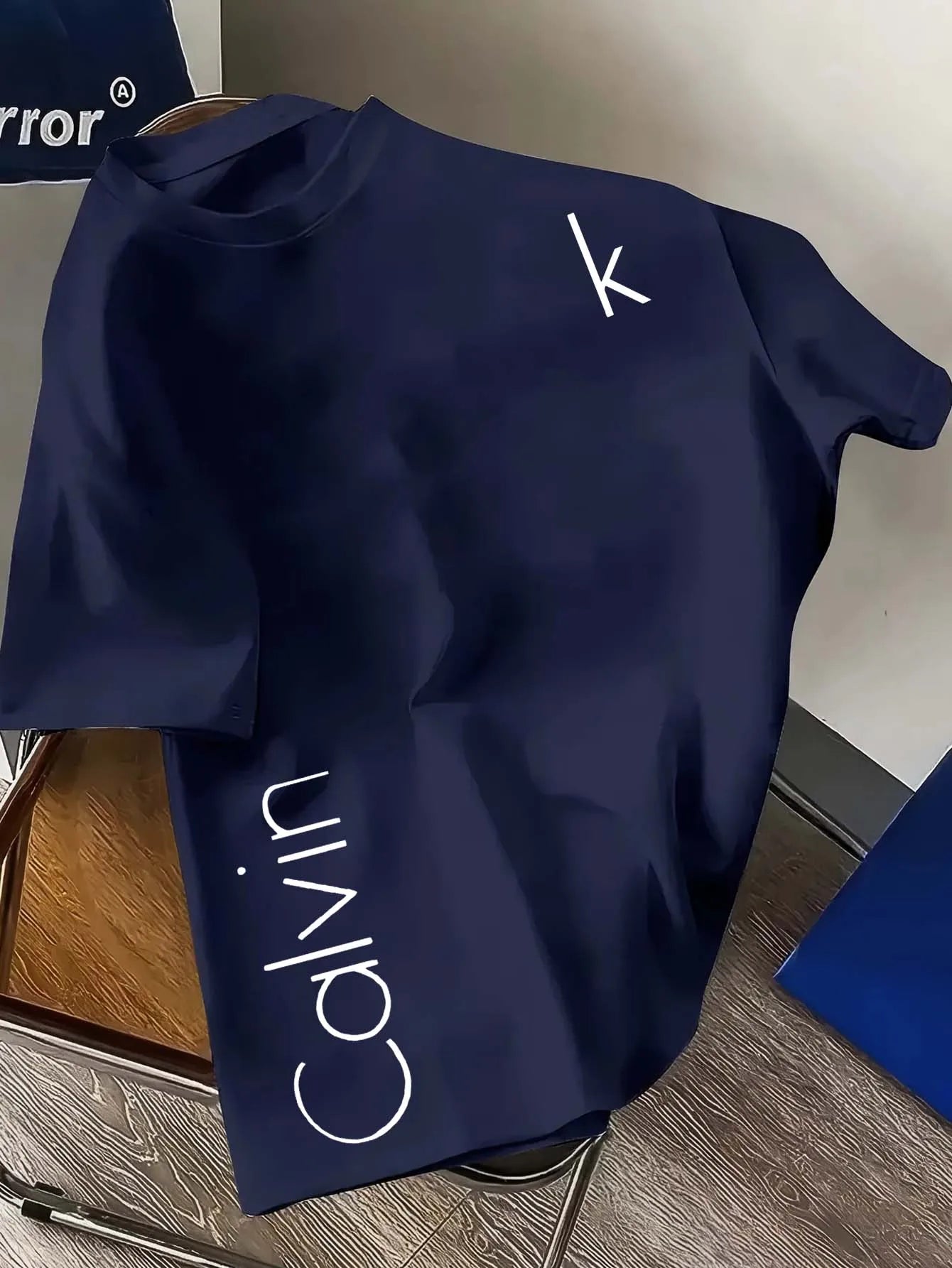 The latest CK letter creative mesh round-neck T-shirt with a fashionable positioning and printing in 2025 is a quick-drying garm